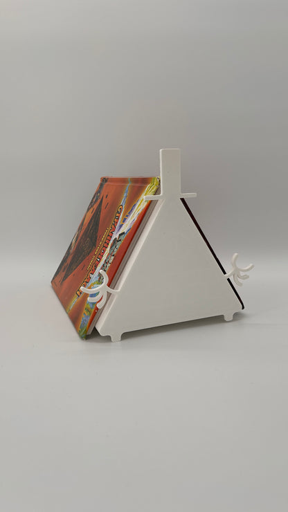 Colorful book or notebook with a white stand on a gray background