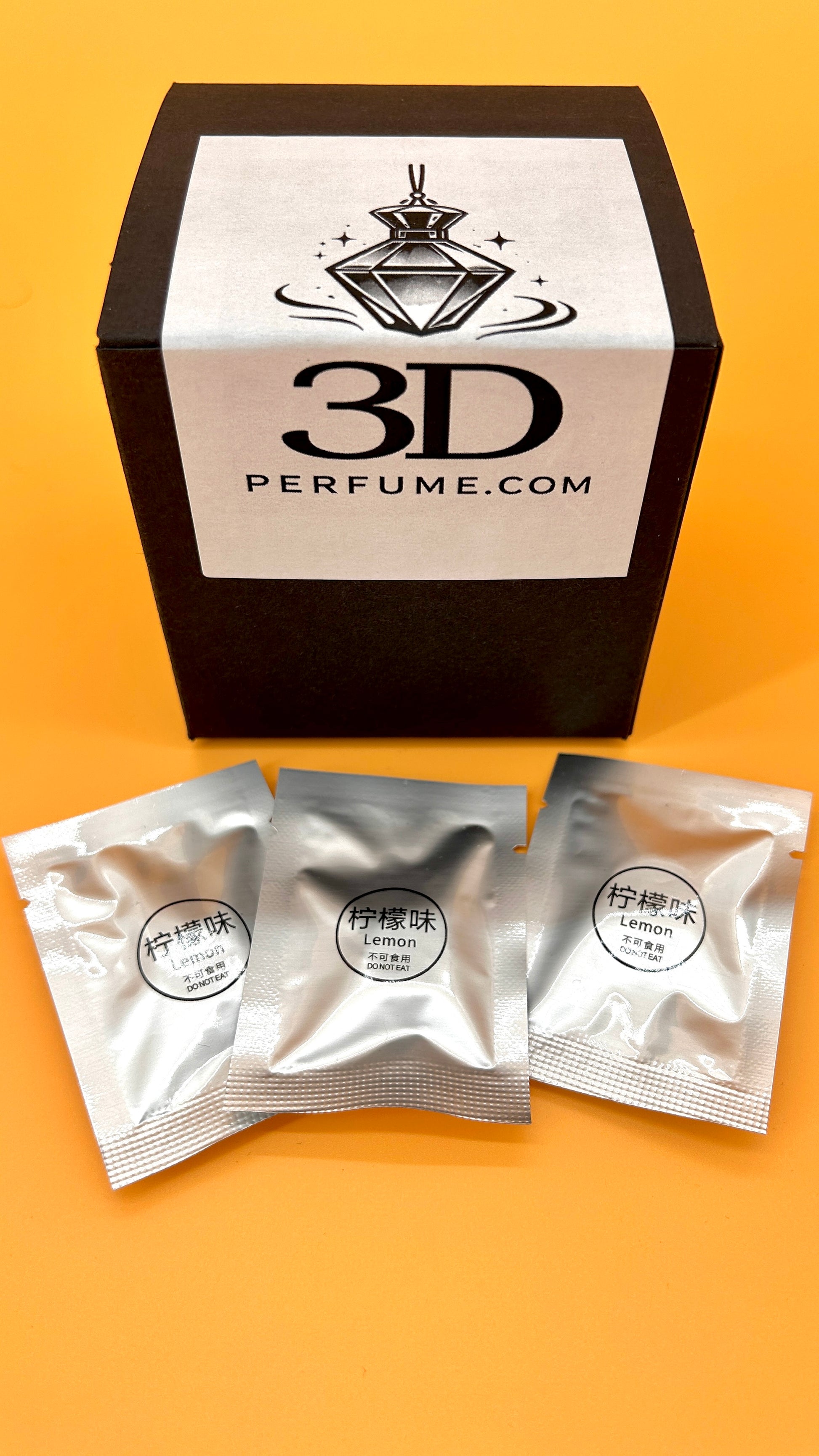 3D Perfume packaging with three sample packets on an orange background